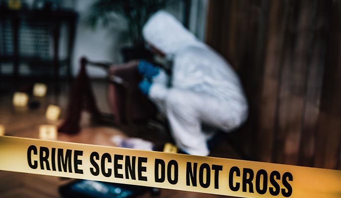 Person cleaning biohazard waste in a restricted area