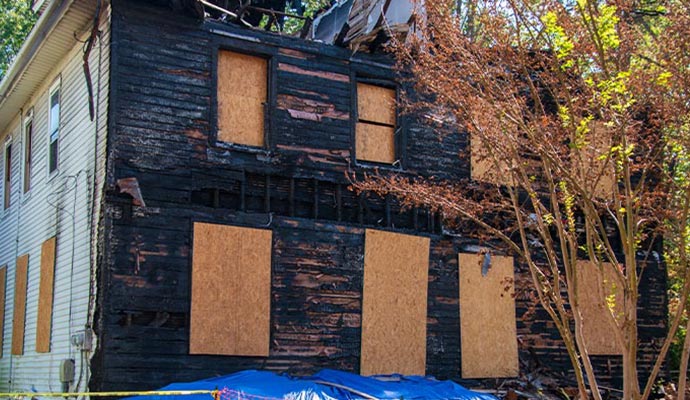A fire-damaged building board-up