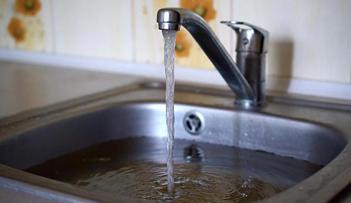 overflowing kitchen sink