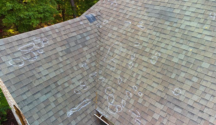 pointing to the absent roof shingle
