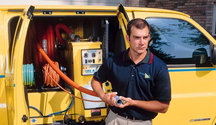 ServiceMaster Professional Restoration service van and worker providing restoration assistance