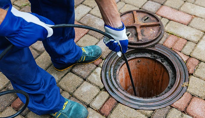 Person performing sewage inspection