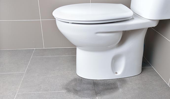 Bathroom floor damaged by leak Bathroom floor damaged by leak