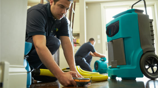 water damaged floor restoration with equipment